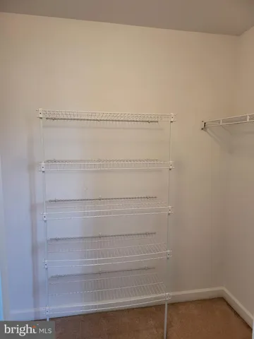 a view of small space with racks on the wall