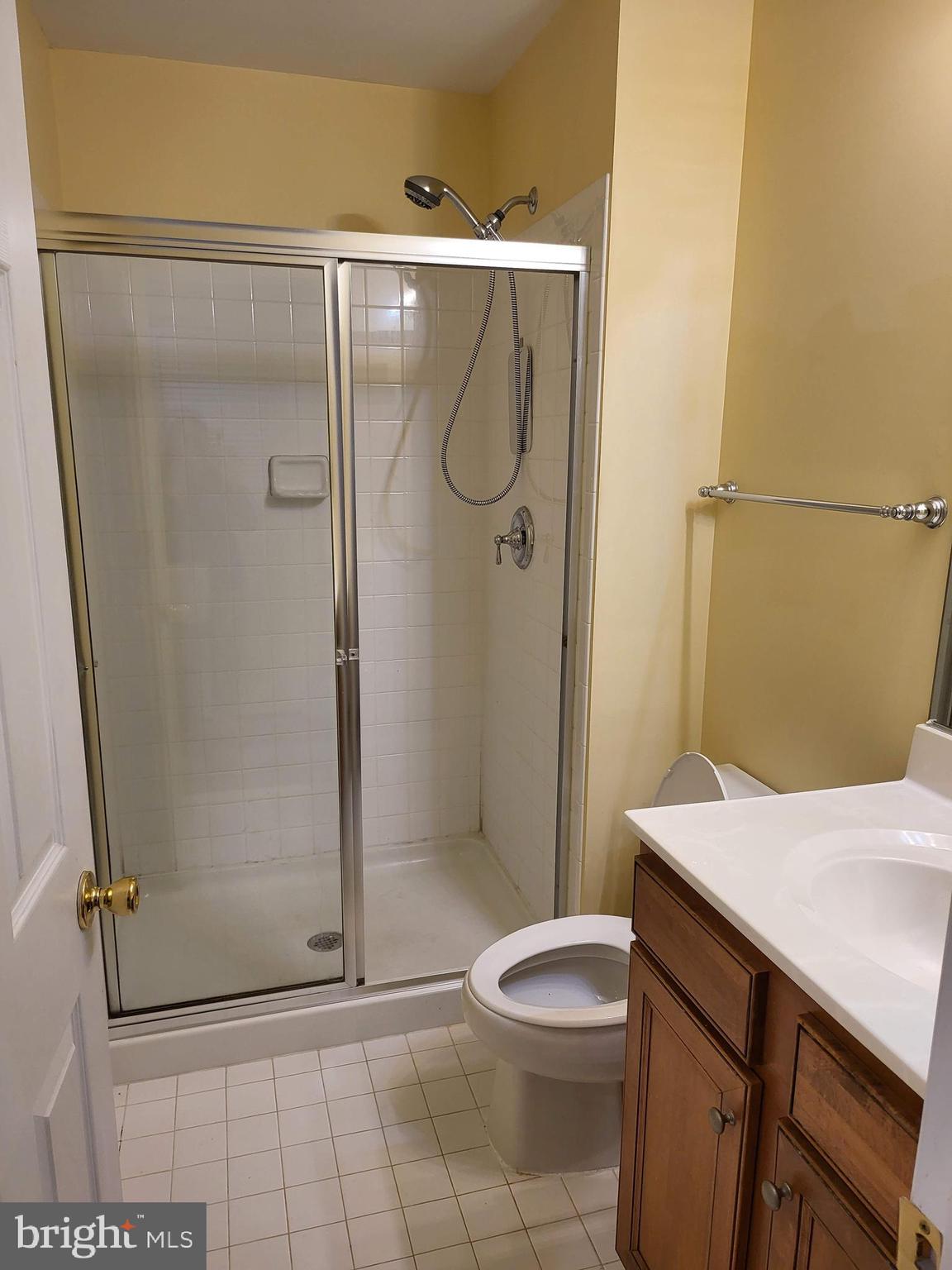 6161 Popes Creek Place Haymarket, VA 20169 - Photo 23 of 23 a bathroom with a granite countertop shower and a toilet