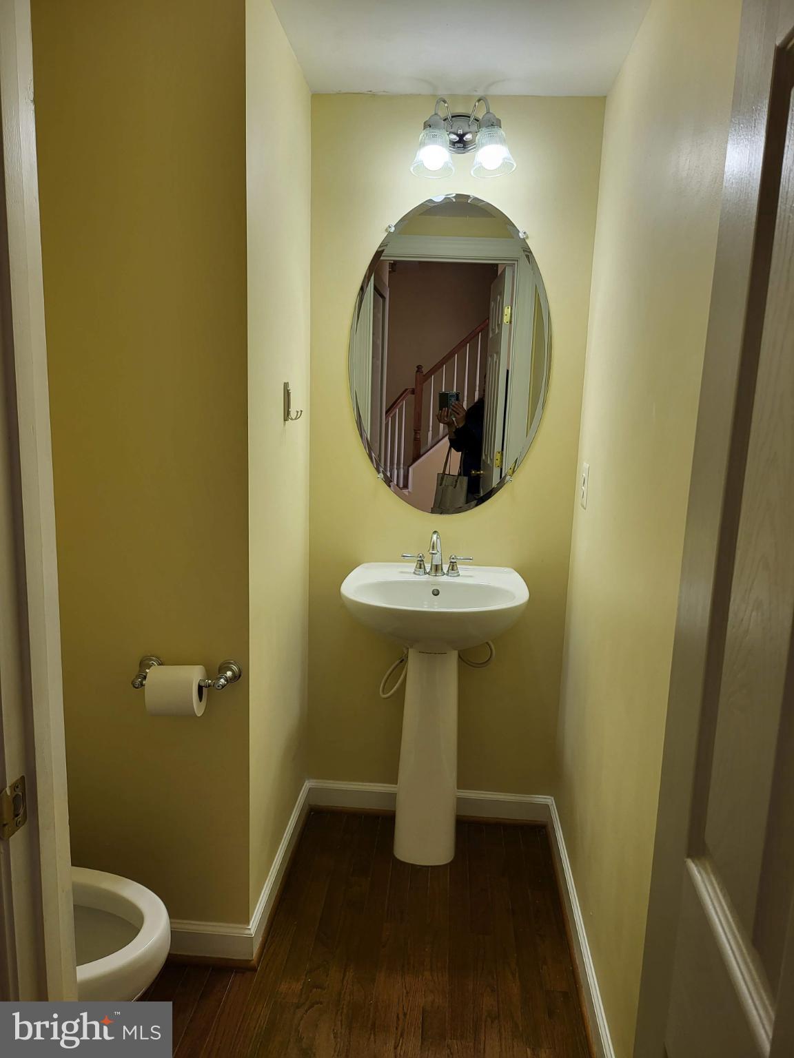 6161 Popes Creek Place Haymarket, VA 20169 - Photo 6 of 23 a bathroom with a sink toilet and a mirror