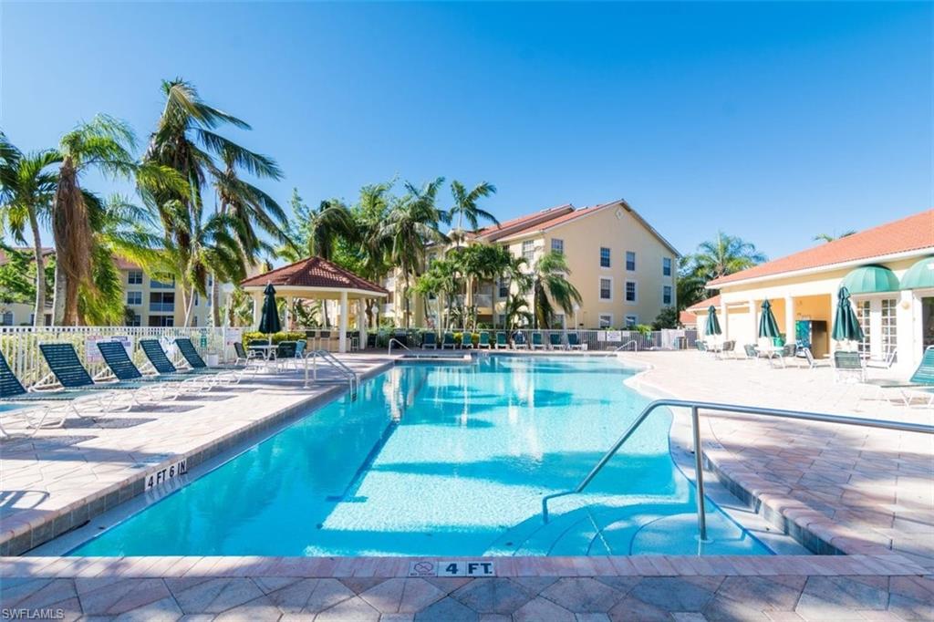 4635 St Croix Lane, Unit 1218 Naples, FL 34109 - Photo 25 of 40 Community pool featuring a patio area and a gazebo