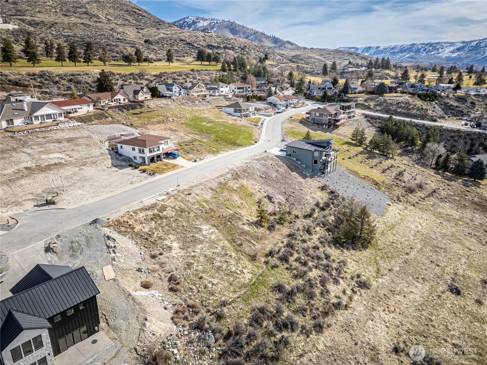 an aerial view of residential houses with outdoor space
