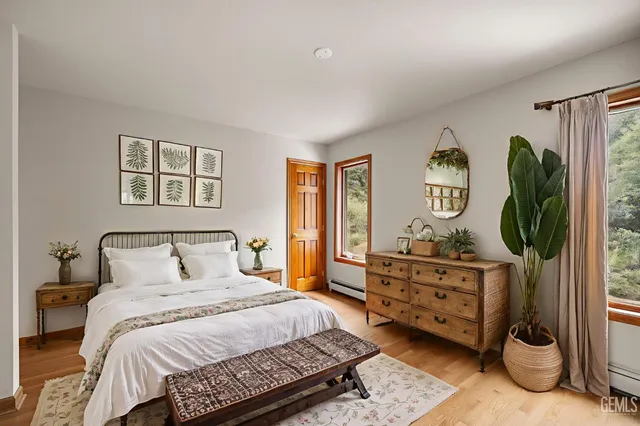 a bathroom with a granite countertop sink a mirror and vanity