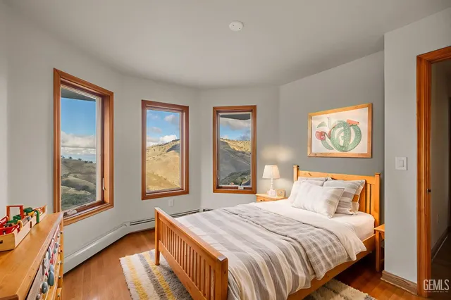 a view of an empty room with windows