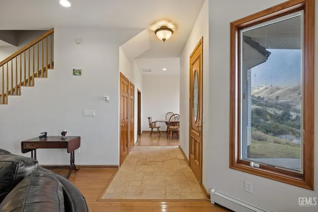 a living room with furniture window and wooden floor