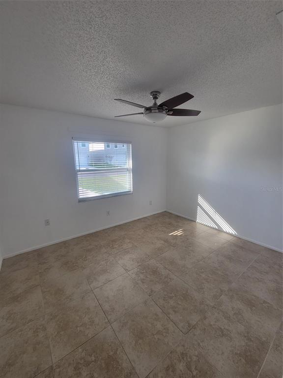 1112 5th Street Port Orange, FL 32129 - Photo 5 of 21 a view of an empty room with a window