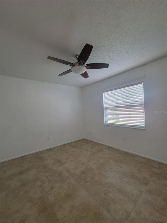 1112 5th Street Port Orange, FL 32129 - Photo 8 of 21 a view of an empty room and window