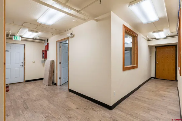a living room with furniture a rug and a chandelier