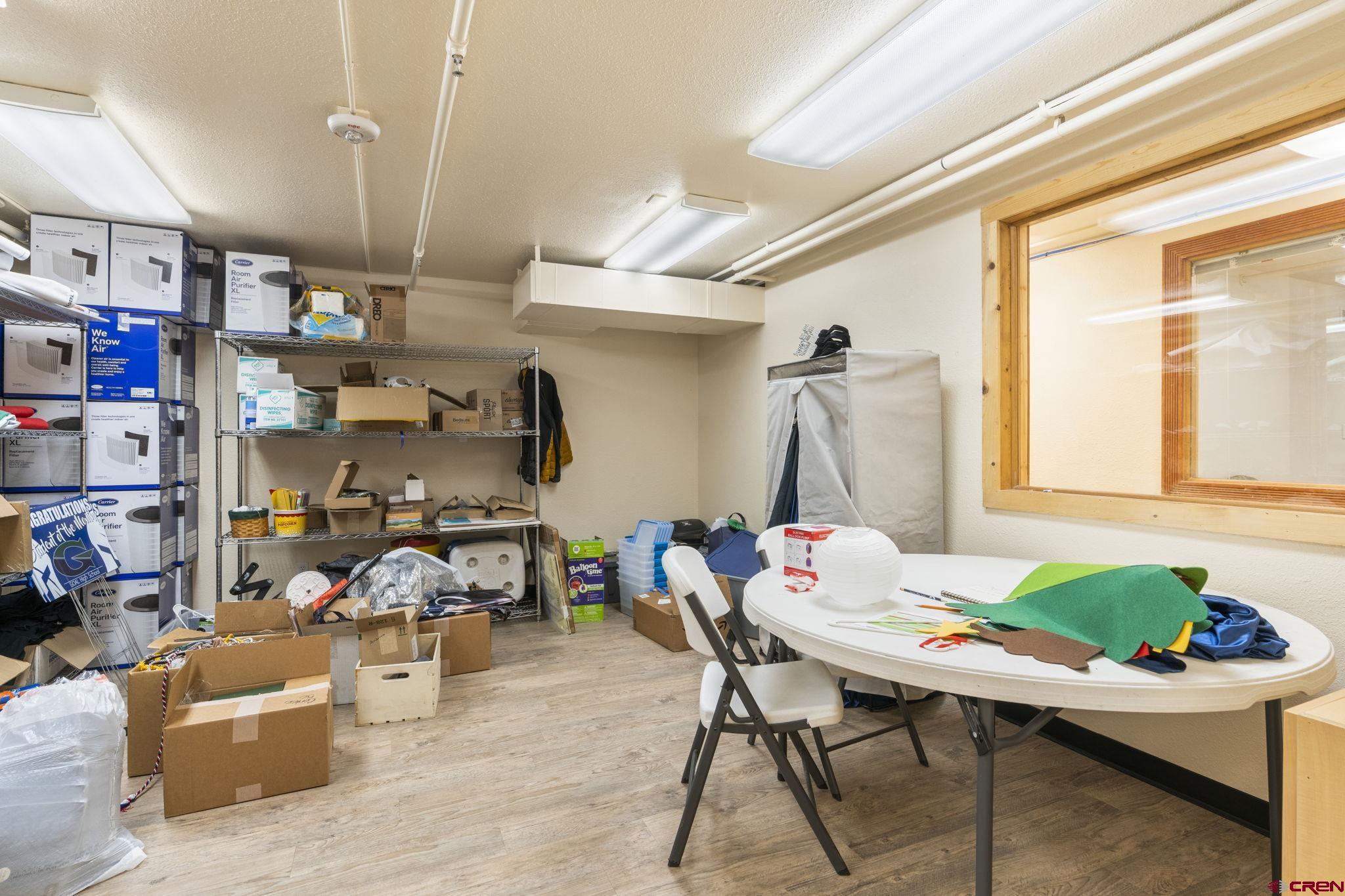 3206 Main Avenue Durango, CO 81301 - Photo 36 of 45 a living room with furniture a rug and a chandelier