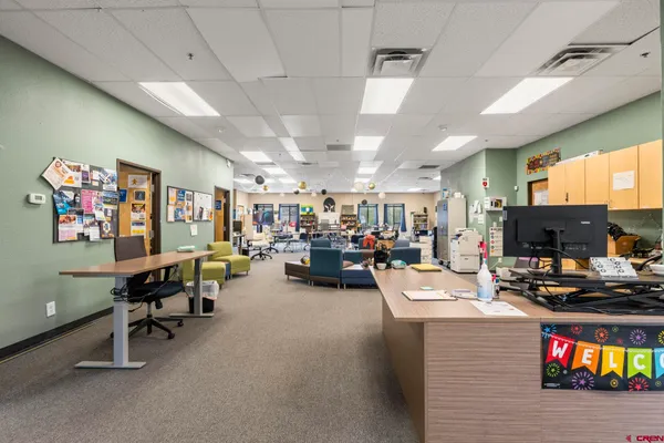 a room with furniture a rug and a table