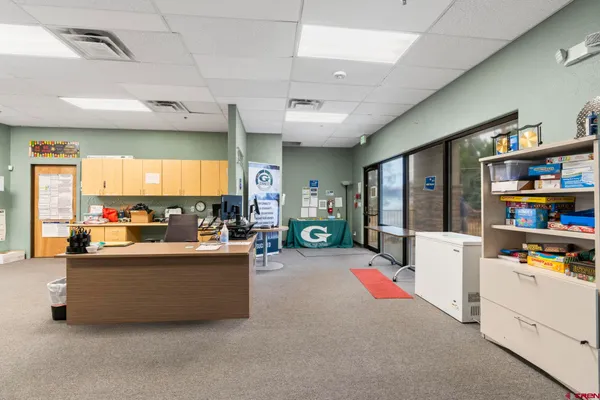 a dining room with a table and chairs