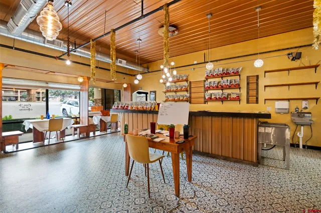 a view of a patio with table and chairs