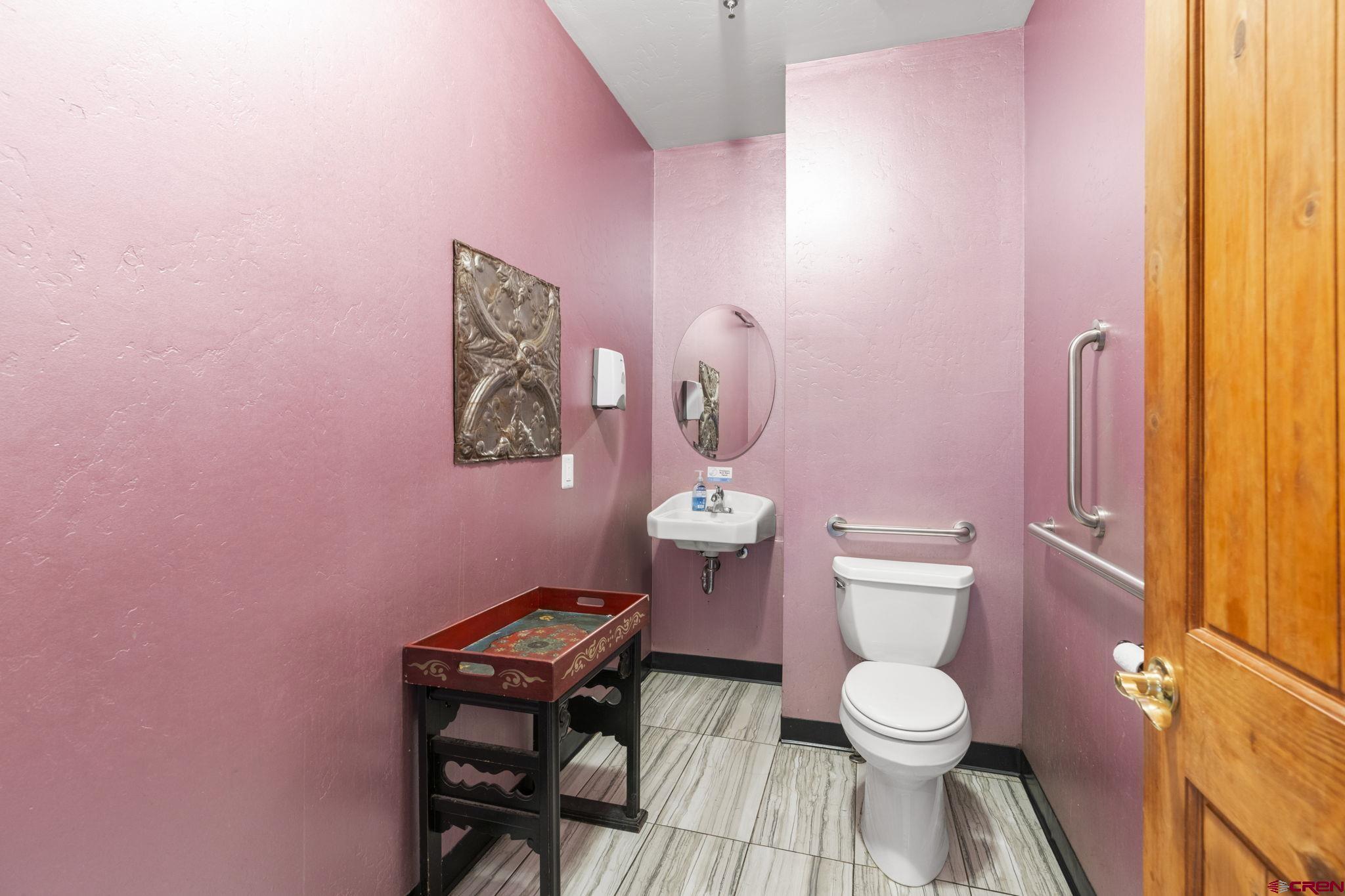 3206 Main Avenue Durango, CO 81301 - Photo 6 of 45 a bathroom with a toilet a sink and a mirror