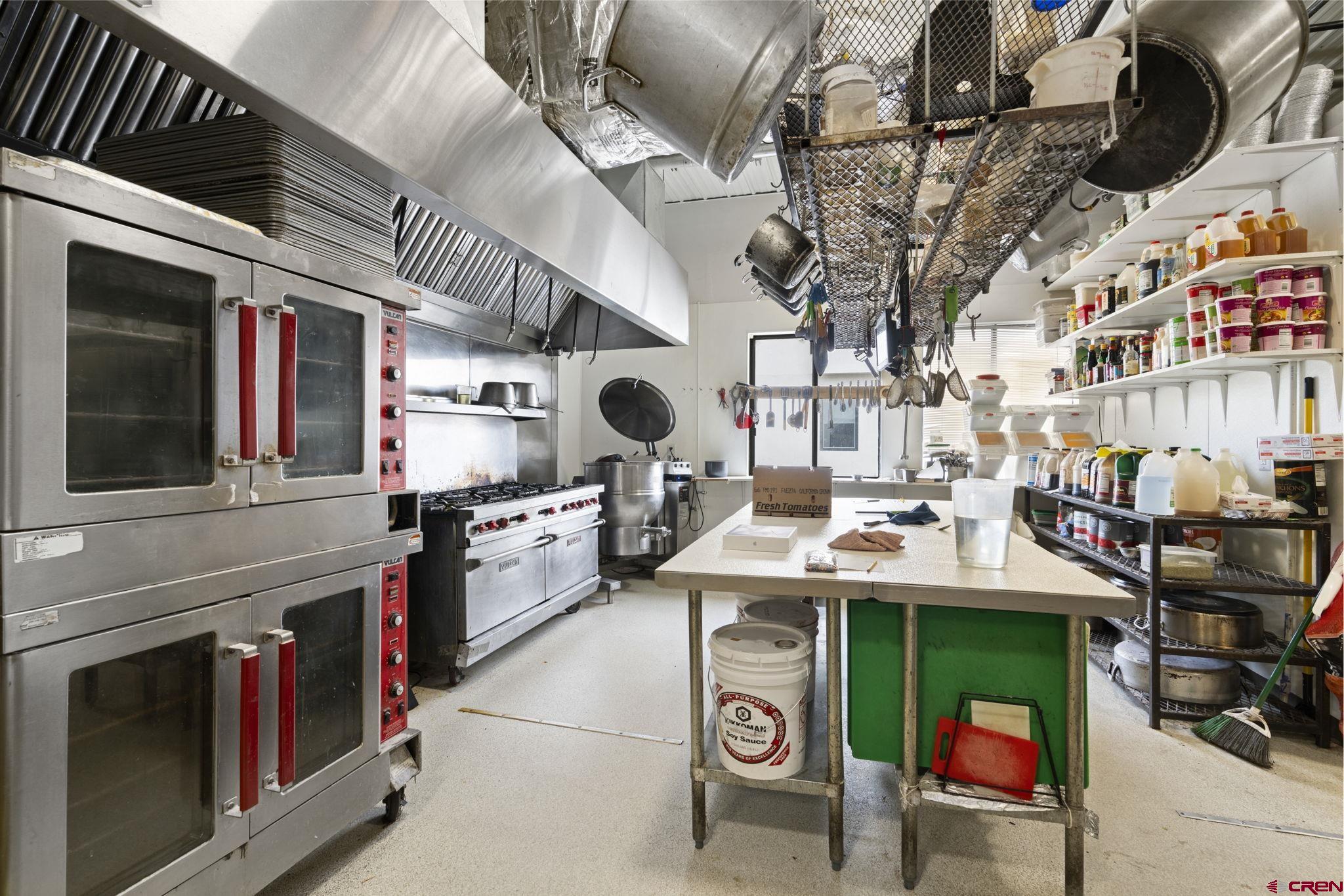 3206 Main Avenue Durango, CO 81301 - Photo 9 of 45 a kitchen with stainless steel appliances granite countertop a stove and a sink