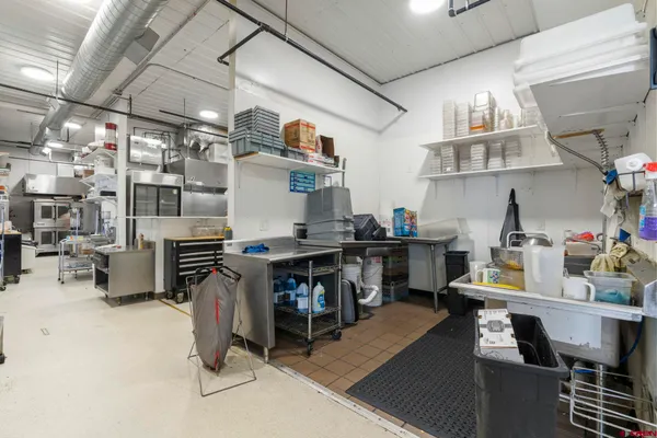 a room with lots of wooden furniture and a table