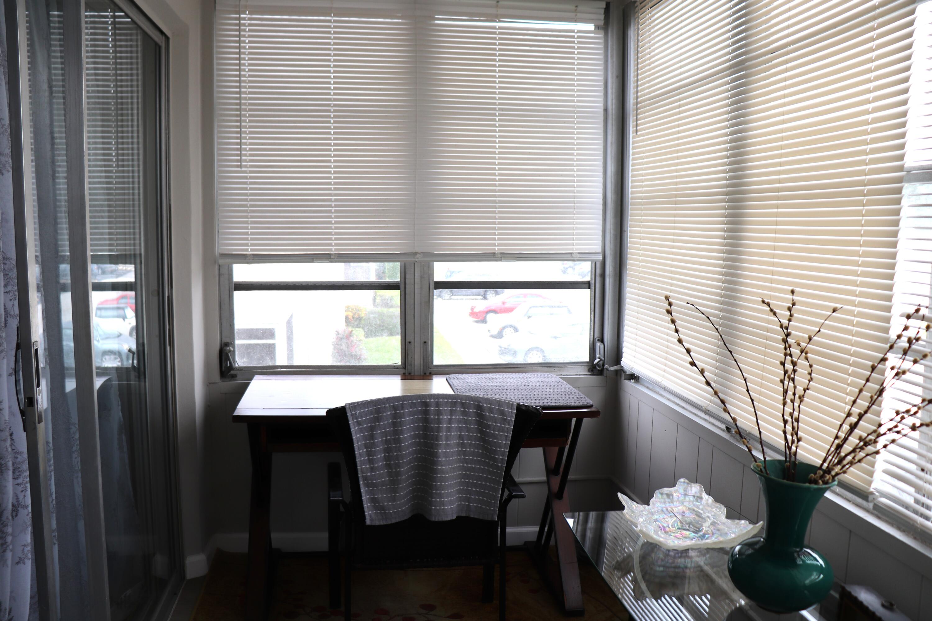 801 Flanders South, Unit Q Delray Beach, FL 33484 - Photo 12 of 15 a view of a dining room with furniture and window