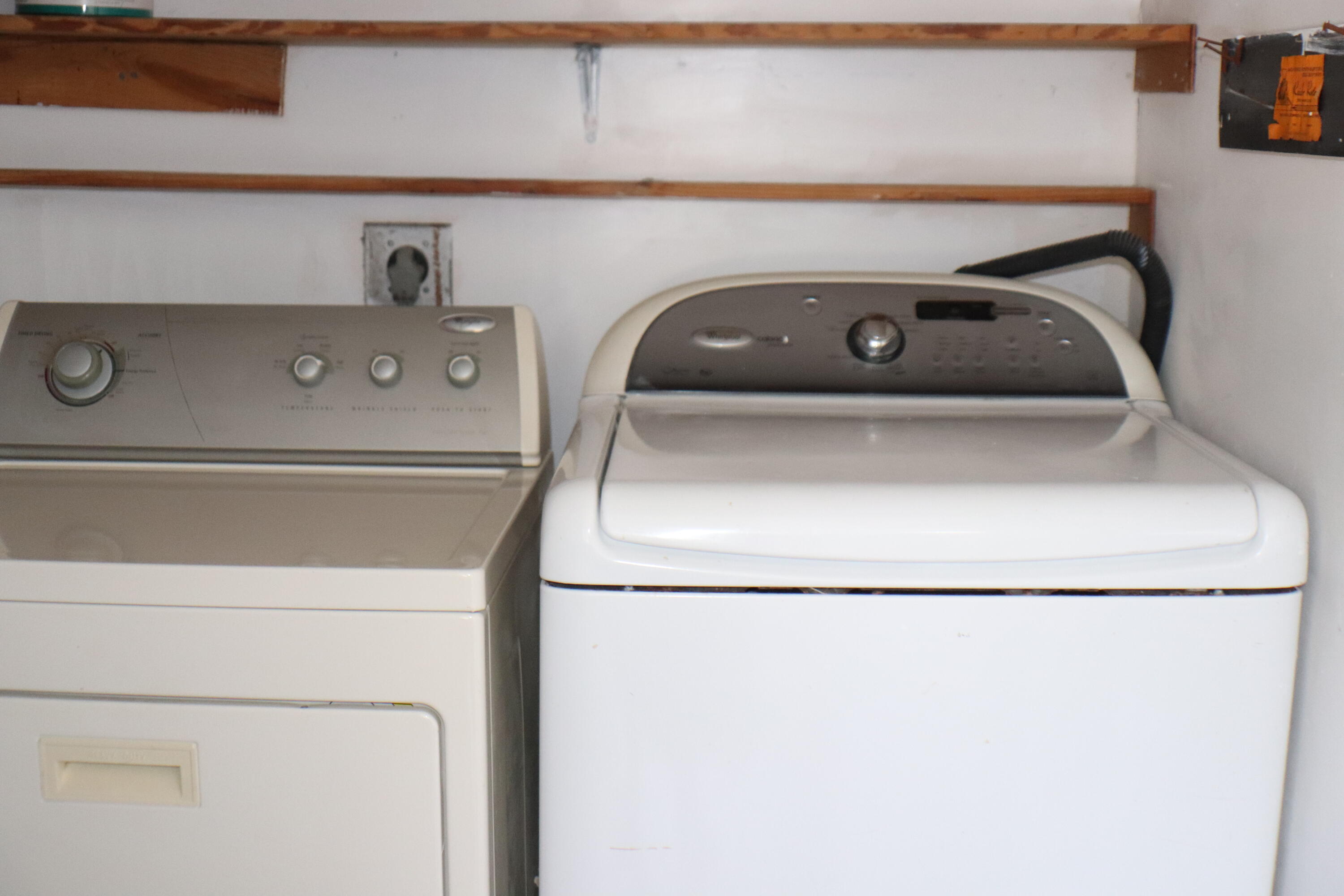 801 Flanders South, Unit Q Delray Beach, FL 33484 - Photo 14 of 15 a utility room with dryer and washer