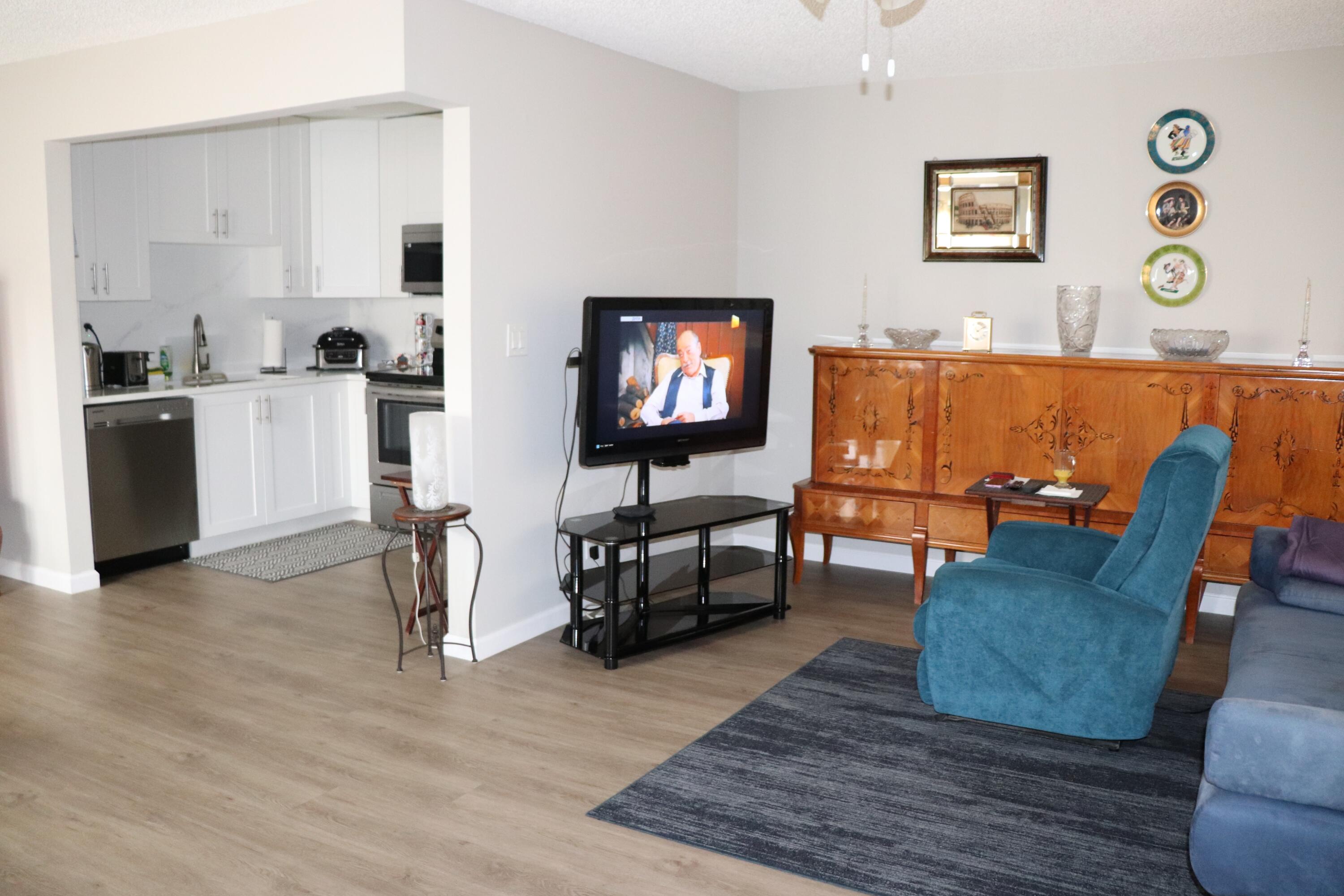 801 Flanders South, Unit Q Delray Beach, FL 33484 - Photo 3 of 15 a living room with furniture and wooden floor