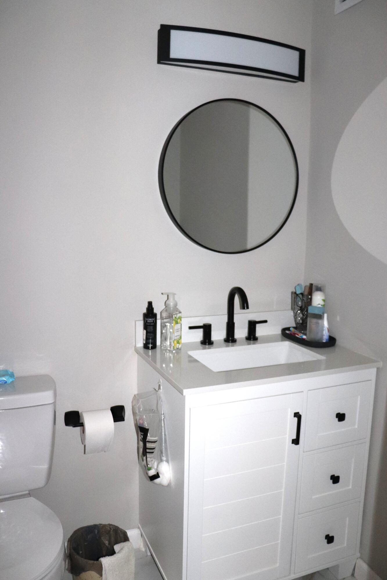 801 Flanders South, Unit Q Delray Beach, FL 33484 - Photo 10 of 15 a bathroom with a sink and a toilet