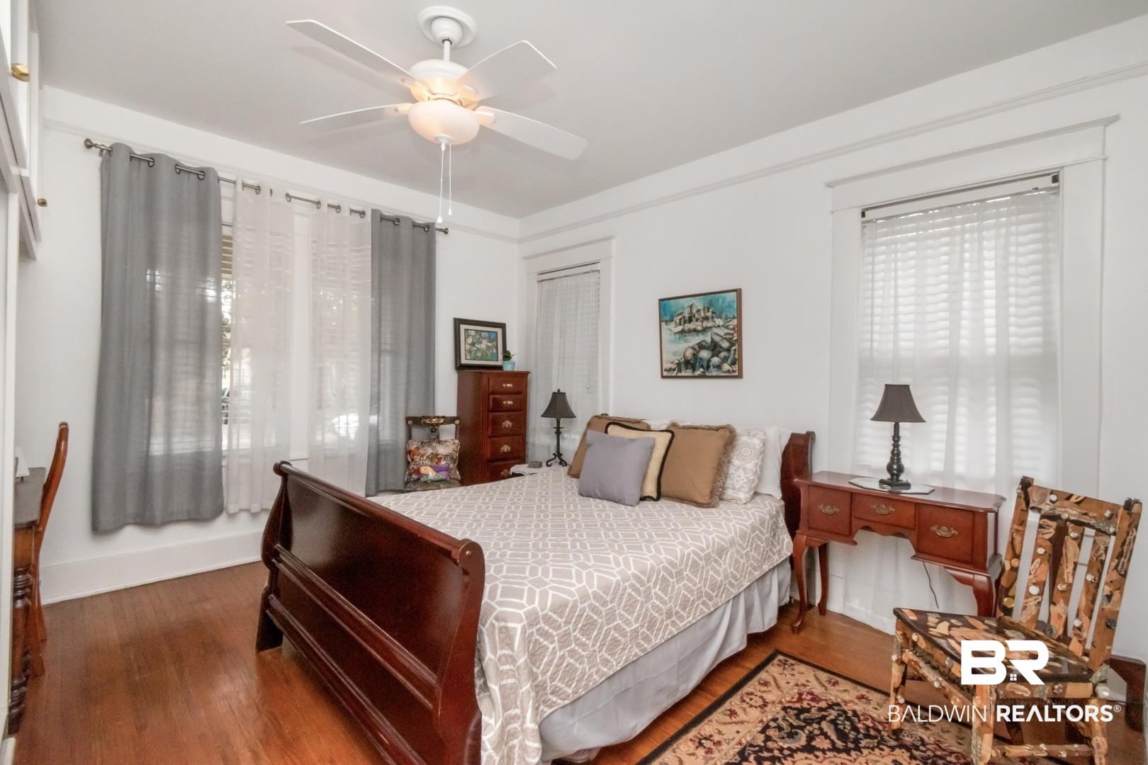 135 Silverwood Street Mobile, AL 36607 - Photo 17 of 32 Bedroom featuring dark wood-style flooring, a closet, and a ceiling fan