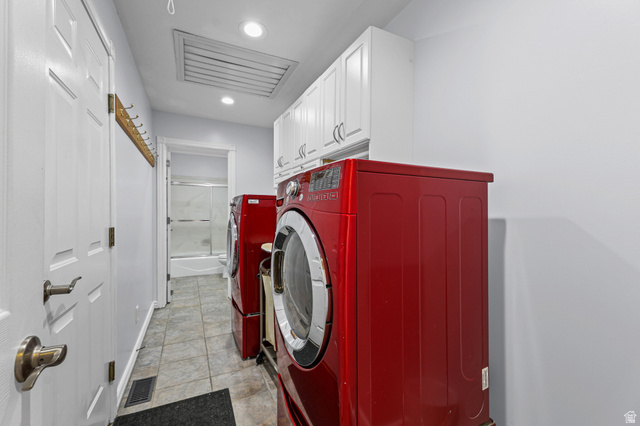 4117 North Wolf Ridge Circle Eden, UT 84310 - Photo 25 of 63 Dedicated laundry room featuring tile flooring, white cabinetry, recessed lighting, and a built-in hanging rack