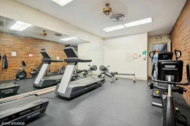 a view of a balcony with floor to ceiling windows and wooden floor