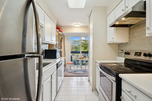 a kitchen that has a sink and a stove