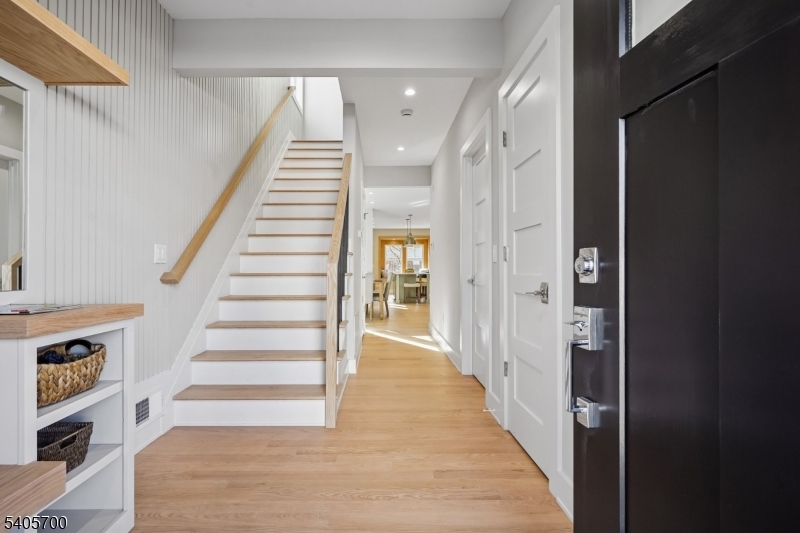8 Willow Street Millburn, NJ 07041 - Photo 17 of 45 a view of a hallway with wooden floor and entryway