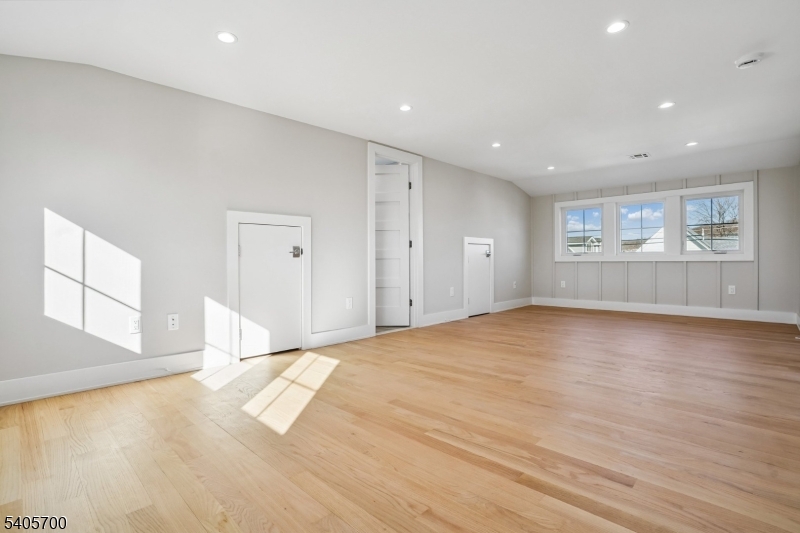 8 Willow Street Millburn, NJ 07041 - Photo 19 of 45 a view of empty room with wooden floor and fan