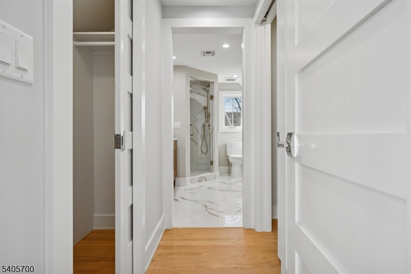 8 Willow Street Millburn, NJ 07041 - Photo 27 of 45 a bathroom with a glass shower door