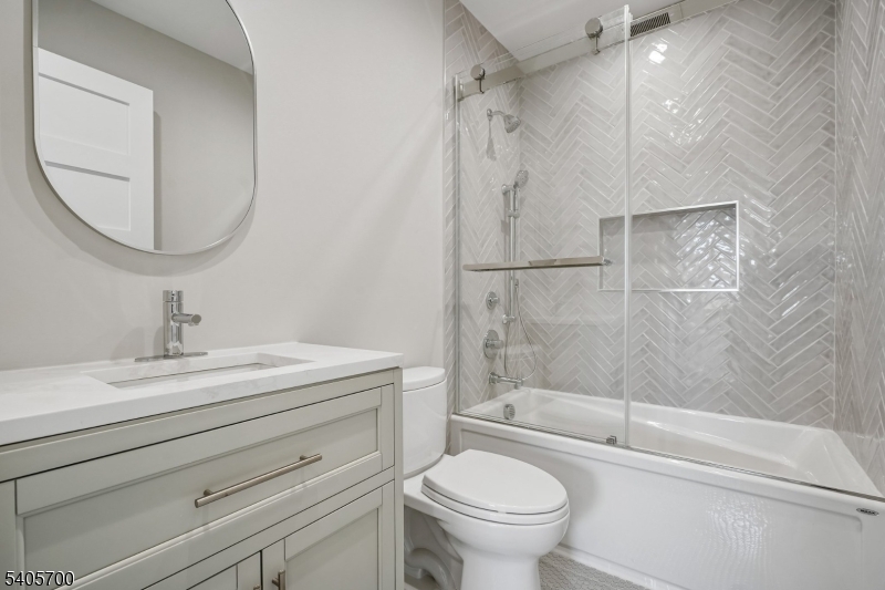 8 Willow Street Millburn, NJ 07041 - Photo 31 of 45 a bathroom with a sink toilet and shower