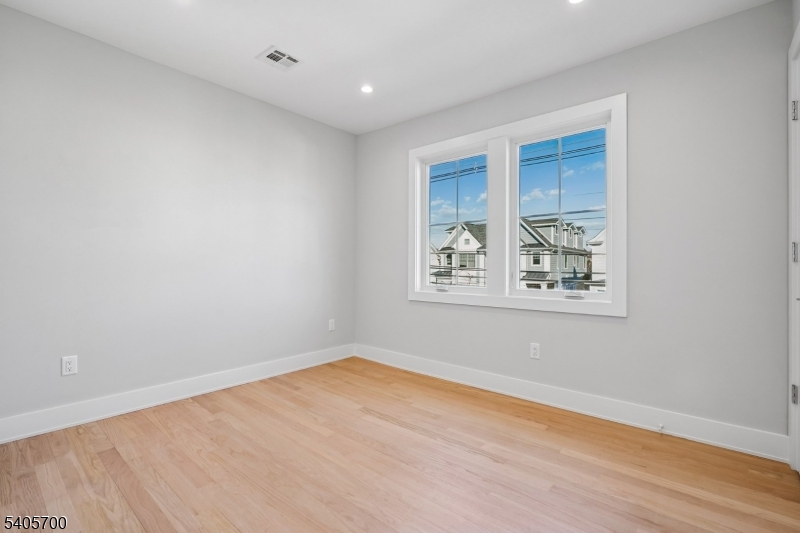 8 Willow Street Millburn, NJ 07041 - Photo 32 of 45 an empty room with windows