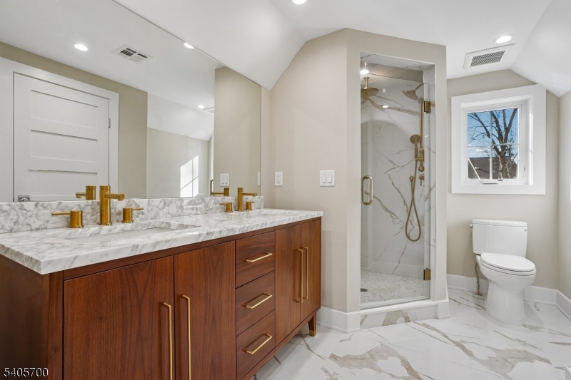 8 Willow Street Millburn, NJ 07041 - Photo 35 of 45 a bathroom with a granite countertop sink toilet and shower