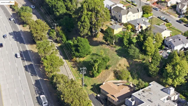 an aerial view of a houses with yard