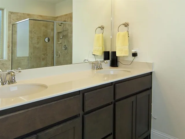 a bedroom with a bed and cabinets