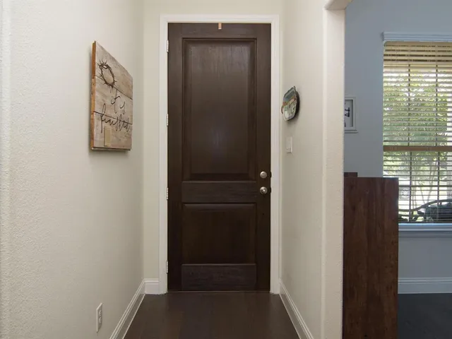 a kitchen with granite countertop a sink a stove and cabinets