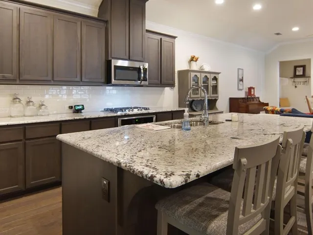 a dining room with furniture and wooden floor