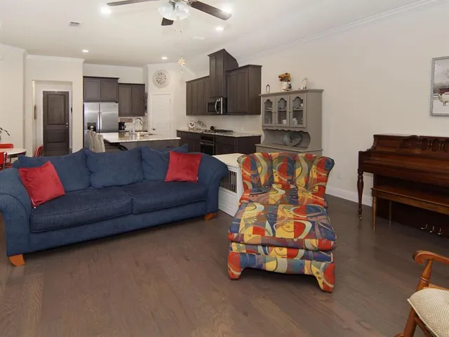 a living room with furniture and a window