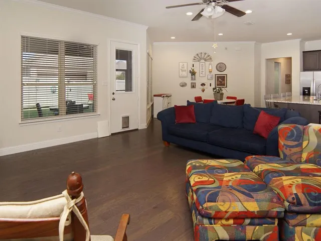 a room with a bed and a dresser