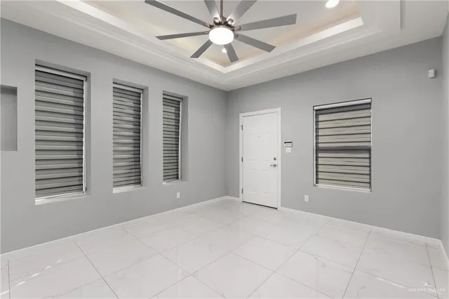 a view of an empty room with a window