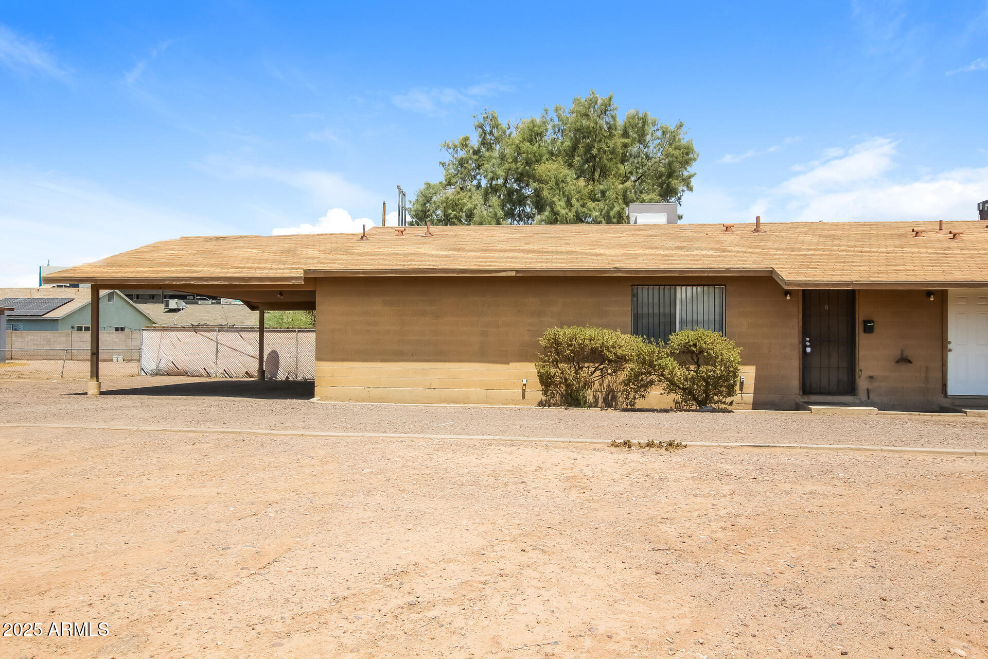 918 South 1st Avenue, Unit 2 Phoenix, AZ 85003 - Photo 15 of 16 a front view of a house with a yard