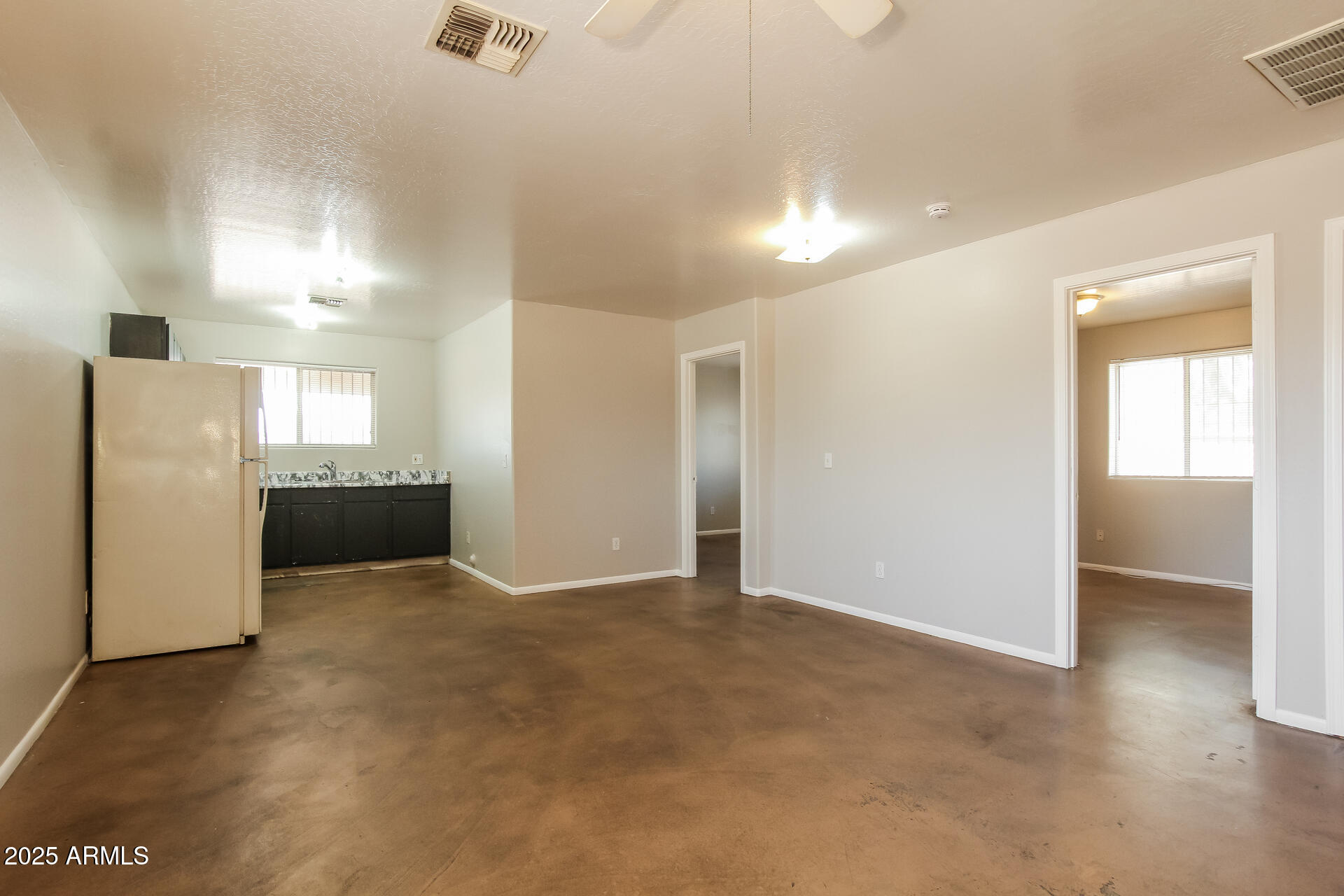 918 South 1st Avenue, Unit 2 Phoenix, AZ 85003 - Photo 2 of 16 a view of a kitchen with a refrigerator a stove top oven and a refrigerator