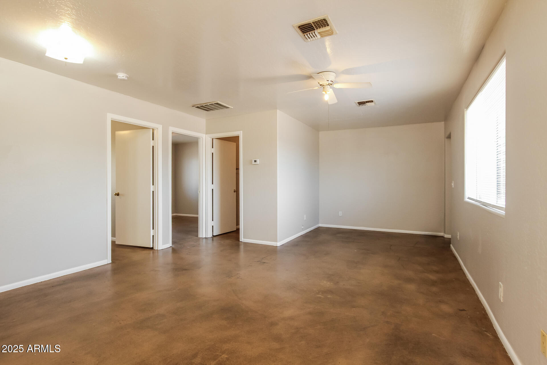 918 South 1st Avenue, Unit 2 Phoenix, AZ 85003 - Photo 3 of 16 wooden floor in an empty room with a window