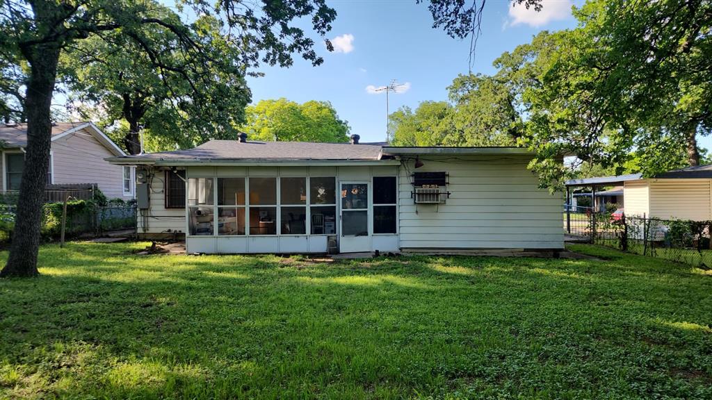 5612 Wainwright Drive Fort Worth, TX 76112 - Photo 17 of 17 a view of a house with a yard and sitting area