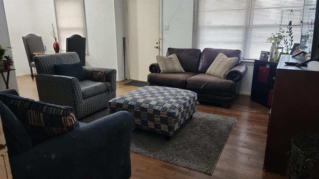 5612 Wainwright Drive Fort Worth, TX 76112 - Photo 4 of 17 a living room with furniture and a large window