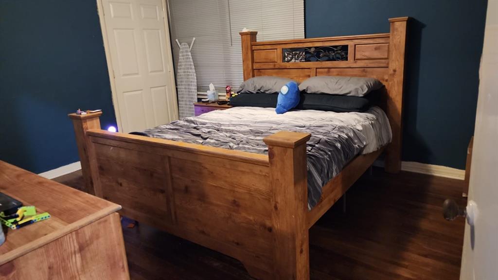 5612 Wainwright Drive Fort Worth, TX 76112 - Photo 7 of 17 a bedroom with a bed and a dresser