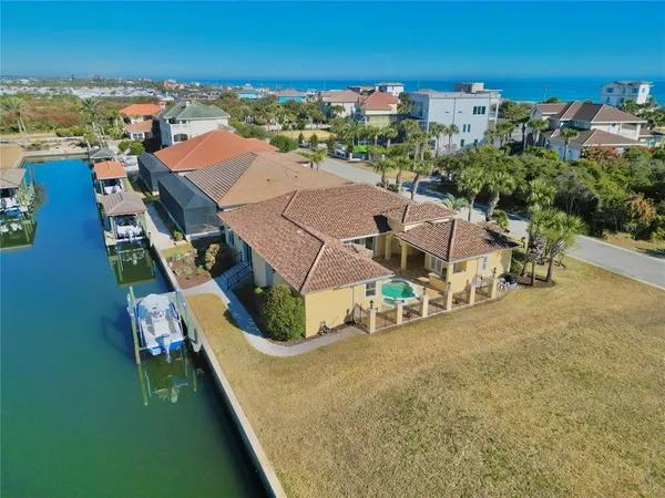 an aerial view of a house with outdoor space