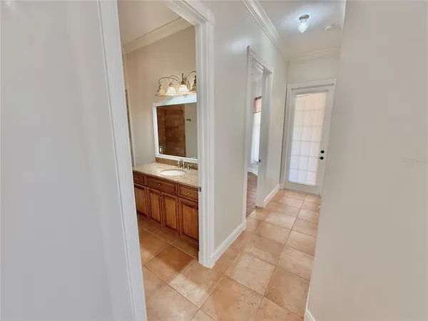 an aerial view of a city with ocean view in back