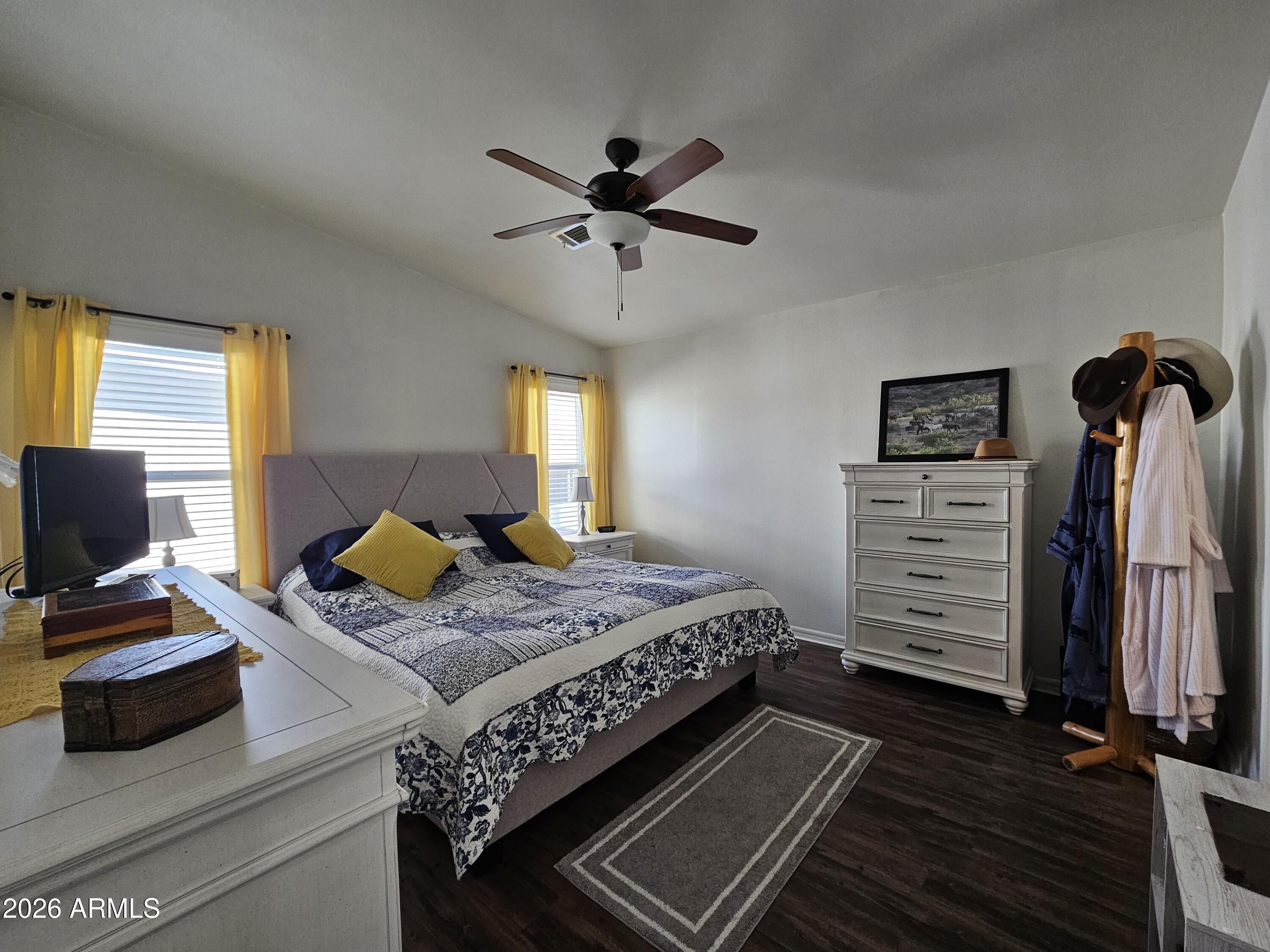 650 North Hawes Road, Unit 3202 Mesa, AZ 85207 - Photo 16 of 35 a bedroom with a bed and furniture