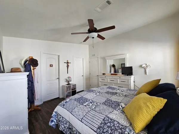 a bathroom with a granite countertop sink a toilet and mirror