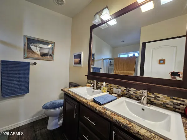 a bathroom with a shower and a window